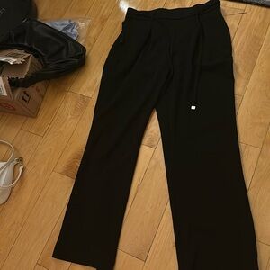 Anne Klein work slacks with stretchy waist band and ties. Very comfortable